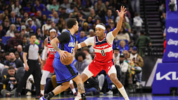 Feb 23, 2025; Orlando, Florida, USA; Washington Wizards guard Bilal Coulibaly (0) defends Orlando Magic guard Cole Anthony (50) during the second quarter at Kia Center. Mandatory Credit: Mike Watters-Imagn Images