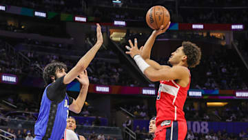 Feb 23, 2025; Orlando, Florida, USA; Washington Wizards guard Jordan Poole (13) shoots against Orlando Magic center Goga Bitadze (35) during the second quarter at Kia Center. Mandatory Credit: Mike Watters-Imagn Images
