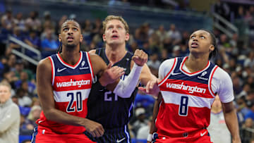 Nov 10, 2024; Orlando, Florida, USA; Washington Wizards forward Alexandre Sarr (20), guard Carlton Carrington (8) and Orlando Magic center Moritz Wagner (21) watch for the rebound during the second half at Kia Center. Mandatory Credit: Mike Watters-Imagn Images