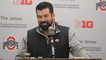 Dec 20, 2023; Columbus, Ohio, USA; Ohio State football coach Ryan Day smiles while reacting a question about the whims of high-school recruits. He held a news conference Wednesday, December 20, 2023 to discuss the class.