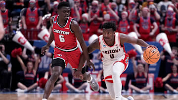Mar 23, 2024; Salt Lake City, UT, USA; Arizona Wildcats guard Jaden Bradley (0) dribbles against Dayton Flyers guard Enoch Cheeks (6) during the second half in the second round of the 2024 NCAA Tournament at Vivint Smart Home Arena-Delta Center. Mandatory Credit: Gabriel Mayberry-Imagn Images