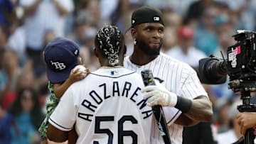 Jul 10, 2023; Seattle, Washington, USA; Chicago White Sox center fielder Luis Robert Jr. (88) congratulates Tampa Bay Rays left fielder Randy Arozarena (56) after the semifinals of the All-Star Home Run Derby at T-Mobile Park.  Mandatory Credit: Joe Nicholson-Imagn Images