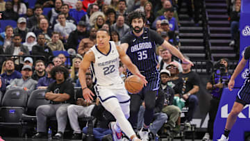 Feb 21, 2025; Orlando, Florida, USA; Memphis Grizzlies guard Desmond Bane (22) moves the ball in front of Orlando Magic center Goga Bitadze (35) during the second quarter at Kia Center. Mandatory Credit: Mike Watters-Imagn Images