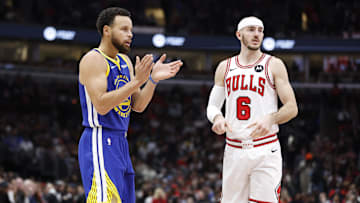 Jan 12, 2024; Chicago, Illinois, USA; Golden State Warriors guard Stephen Curry (30) reacts after a play against Chicago Bulls guard Alex Caruso (6) during the first half at United Center. Mandatory Credit: Kamil Krzaczynski-Imagn Images