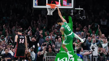 Apr 24, 2024; Boston, Massachusetts, USA; Boston Celtics forward Jayson Tatum (0) makes the basket against the Miami Heat in the first quarter during game two of the first round for the 2024 NBA playoffs at TD Garden. Mandatory Credit: David Butler II-USA TODAY Sports