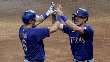 Oct 15, 2023; Houston, Texas, USA; Texas Rangers third baseman Josh Jung (6) and center fielder Evan Carter (32) celebrate after Carter scored during the first inning of game one of the ALCS against the Houston Astros in the 2023 MLB playoffs at Minute Maid Park. Mandatory Credit: Thomas Shea-USA TODAY Sports