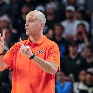 Mar 5, 2025; Orlando, Florida, USA; Oklahoma State Cowboys head coach Steve Lutz motions to the court during the first half against the UCF Knights at Addition Financial Arena. Mandatory Credit: Mike Watters-Imagn Images
