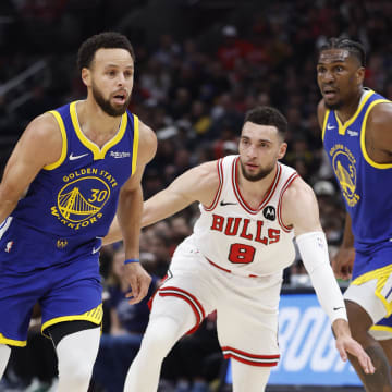 Jan 12, 2024; Chicago, Illinois, USA; Golden State Warriors guard Stephen Curry (30) dribbles against Chicago Bulls guard Zach LaVine (8) during the first half at United Center. Mandatory Credit: Kamil Krzaczynski-USA TODAY Sports
