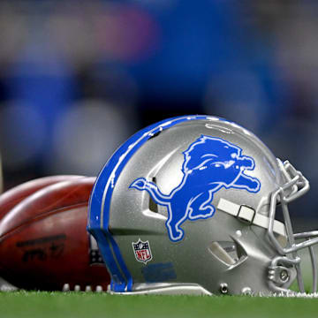 Jan 14, 2024; Detroit, Michigan, USA;  Footballs and a Detroit Lions helmet before a 2024 NFC wild card game between the Lions and Los Angeles Rams at Ford Field. Mandatory Credit: Lon Horwedel-Imagn Images