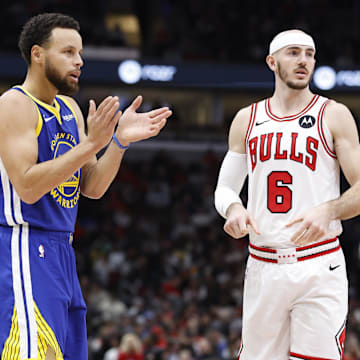 Jan 12, 2024; Chicago, Illinois, USA; Golden State Warriors guard Stephen Curry (30) reacts after a play against Chicago Bulls guard Alex Caruso (6) during the first half at United Center. Mandatory Credit: Kamil Krzaczynski-Imagn Images