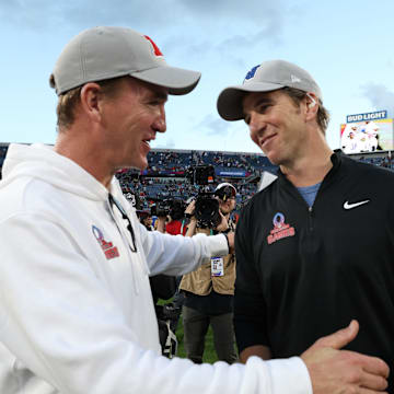 Feb 4, 2024; Orlando, FL, USA; NFC coach Eli Manning and AFC coach Peyton Manning react after the 2024 Pro Bowl at Camping World Stadium.  