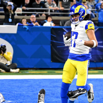 Jan 14, 2024; Detroit, Michigan, USA; Los Angeles Rams wide receiver Puka Nacua (17) scores a touchdown against Detroit Lions cornerback Cameron Sutton (1) during the first half of a 2024 NFC wild card game at Ford Field. Mandatory Credit: Lon Horwedel-USA TODAY Sports