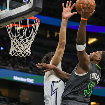 Minnesota Timberwolves guard Anthony Edwards (5) goes to the basket against Orlando Magic center Goga Bitadze (35) during the second half at Kia Center.