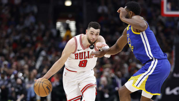 Zach LaVine drives against Golden State Warriors forward Andrew Wiggins