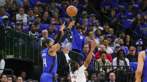 Apr 25, 2024; Orlando, Florida, USA; Orlando Magic guard Gary Harris (14) shoots the ball over Cleveland Cavaliers guard Darius Garland (10) during the first quarter of game three of the first round for the 2024 NBA playoffs at Kia Center. Mandatory Credit: Mike Watters-USA TODAY Sports