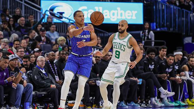 Orlando Magic guard Desmond Bane passes the ball in front of Boston Celtics guard Derrick White