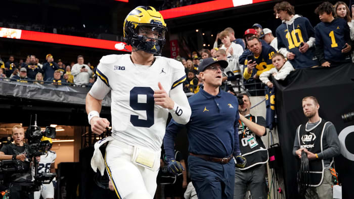 Dec 2, 2023; Indianapolis, IN, USA; Michigan Wolverines quarterback J.J. McCarthy (9) and head coach Jim Harbaugh