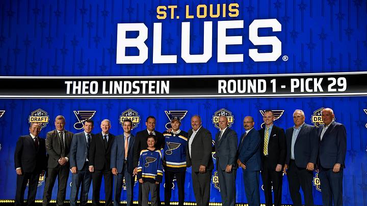 Jun 28, 2023; Nashville, Tennessee, USA; St. Louis Blues draft pick Theo Lindstein stands with Blues staff after being selected with the twenty ninth pick in round one of the 2023 NHL Draft at Bridgestone Arena. Mandatory Credit: Christopher Hanewinckel-Imagn Images