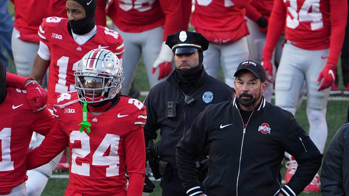 Ohio State University football coach Ryan Day tries to join the team to sing Carmen Ohio after the Michigan game Saturday, November 30, 2024 in Ohio Stadium. As he was standing here, the melee was starting behind him as Michigan players tried to plant a flag at midfield.