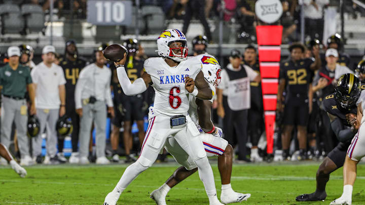 Oct 4, 2025; Orlando, Florida, USA; Kansas Jayhawks quarterback Jalon Daniels (6) throws a pass during the first quarter against the UCF Knights at FBC Mortgage Stadium. Mandatory Credit: Mike Watters-Imagn Images