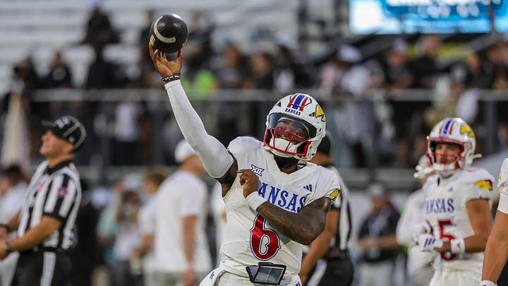 Oct 4, 2025; Orlando, Florida, USA; Kansas Jayhawks quarterback Jalon Daniels (6) warms up before the game against the UCF Knights at FBC Mortgage Stadium. Mandatory Credit: Mike Watters-Imagn Images