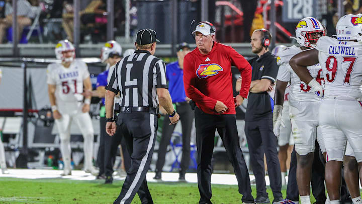 Oct 4, 2025; Orlando, Florida, USA; Kansas Jayhawks head coach Lance Leipold talks with an official during the second quarter against the UCF Knights at FBC Mortgage Stadium. Mandatory Credit: Mike Watters-Imagn Images