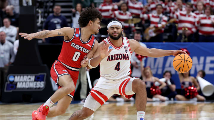 Mar 23, 2024; Salt Lake City, UT, USA; Arizona Wildcats guard Kylan Boswell (4) dribbles against Dayton Flyers guard Javon Bennett (0) during the first half in the second round of the 2024 NCAA Tournament at Vivint Smart Home Arena-Delta Center. Mandatory Credit: Rob Gray-USA TODAY Sports