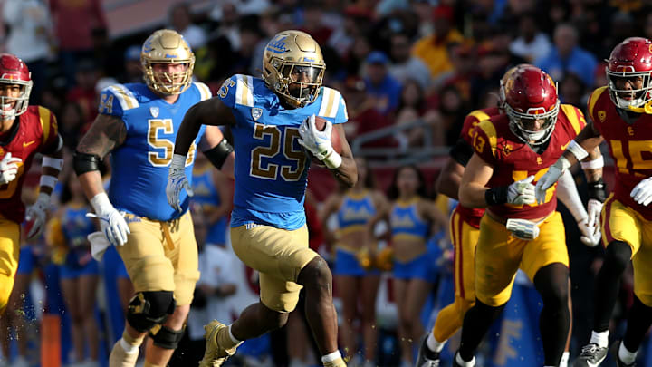 Nov 18, 2023; Los Angeles, California, USA; UCLA Bruins running back TJ Harden (25) runs during the third quarter against the USC Trojans at United Airlines Field at Los Angeles Memorial Coliseum. Mandatory Credit: Jason Parkhurst-Imagn Images