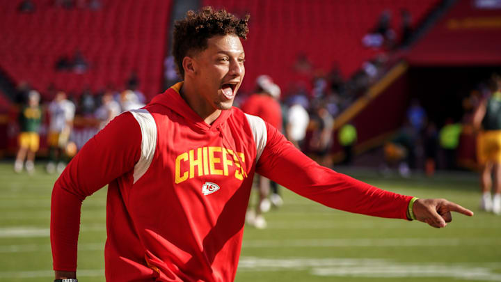 Aug 25, 2022; Kansas City, Missouri, USA; Kansas City Chiefs quarterback Patrick Mahomes (15) laughs after catching a pass over tight end Travis Kelce (not pictured) during warm ups before a preseason game against the Green Bay Packers at GEHA Field at Arrowhead Stadium. Mandatory Credit: Denny Medley-Imagn Images