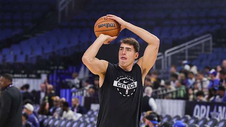 Nov 9, 2025; Orlando, Florida, USA; Boston Celtics center Luka Garza (52) warms up before the game against the Orlando Magic at Kia Center. Mandatory Credit: Mike Watters-Imagn Images
