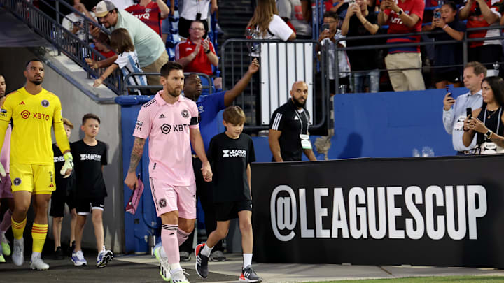 Aug 6, 2023; Frisco, TX, USA; Inter Miami CF forward Lionel Messi (10) walks onto the pitch with a kid before a match against FC Dallas at Toyota Stadium. Mandatory Credit: Kevin Jairaj-Imagn Images Aug 6, 2023; Frisco, TX, USA; Inter Miami CF forward Lionel Messi (10) walks onto the pitch with a kid before a match against FC Dallas at Toyota Stadium. Mandatory Credit: Kevin Jairaj-Imagn Images