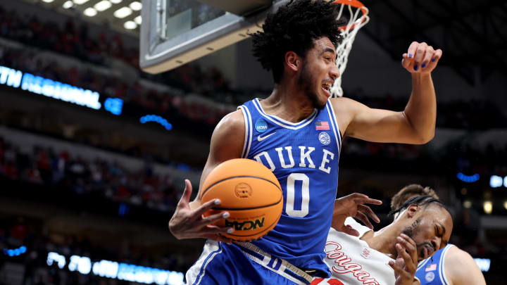 Mar 29, 2024; Dallas, TX, USA; Duke Blue Devils guard Jared McCain (0) rebounds against Houston Cougars forward J'Wan Roberts (13) during the first half in the semifinals of the South Regional of the 2024 NCAA Tournament at American Airlines Center. Mandatory Credit: Tim Heitman-USA TODAY Sports 