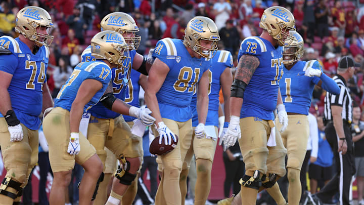 Nov 18, 2023; Los Angeles, California, USA; UCLA Bruins tight end Hudson Habermehl (81) celebrates with teammates after scoring a touchdown during the fourth quarter against the USC Trojans at United Airlines Field at Los Angeles Memorial Coliseum. Mandatory Credit: Jason Parkhurst-Imagn Images