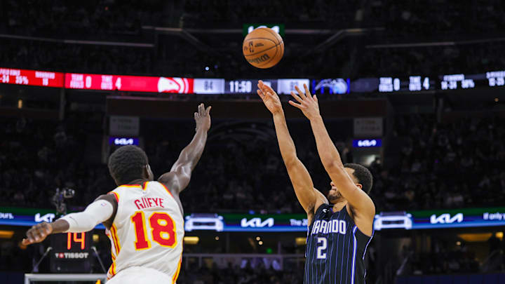 Apr 8, 2025; Orlando, Florida, USA; Orlando Magic guard Caleb Houstan (2) shoots a three point basket against Atlanta Hawks forward Mouhamed Gueye (18) during the second half at Kia Center. Mandatory Credit: Mike Watters-Imagn Images Apr 8, 2025; Orlando, Florida, USA; Orlando Magic guard Caleb Houstan (2) shoots a three point basket against Atlanta Hawks forward Mouhamed Gueye (18) during the second half at Kia Center. Mandatory Credit: Mike Watters-Imagn Images