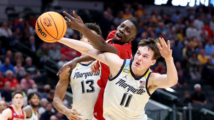 Mar 29, 2024; Dallas, TX, USA; North Carolina State Wolfpack forward Mohamed Diarra (23) and Marquette Golden Eagles guard Tyler Kolek (11) fight for a loose ball during the second half in the semifinals of the South Regional of the 2024 NCAA Tournament at American Airlines Center. Mandatory Credit: Kevin Jairaj-USA TODAY Sports 