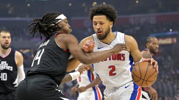 Feb 10, 2024; Los Angeles, California, USA;  Los Angeles Clippers guard Terance Mann (14) defends Detroit Pistons guard Cade Cunningham (2) in the first half at Crypto.com Arena. Mandatory Credit: Jayne Kamin-Oncea-USA TODAY Sports