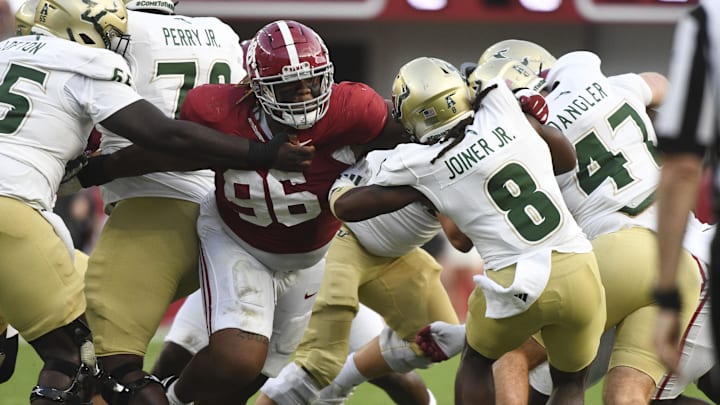 Sep 7, 2024; Tuscaloosa, Alabama, USA;  Alabama Crimson Tide defensive lineman Tim Keenan III (96) stops South Florida Bulls running back Kelley Joiner (8) during the first half at Bryant-Denny Stadium. Mandatory Credit: Gary Cosby Jr.-Imagn Images