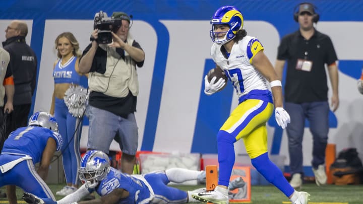 Jan 14, 2024; Detroit, Michigan, USA; Los Angeles Rams wide receiver Puka Nacua (17) scores a touchdown against Detroit Lions safety C.J. Gardner-Johnson (2) and cornerback Cameron Sutton (1) during the first half of a 2024 NFC wild card game at Ford Field.