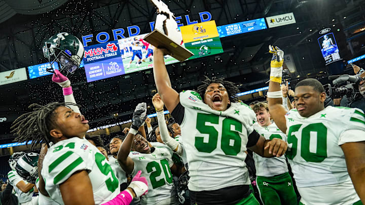 Detroit Cass Tech’s Antijuan Wilkes Jr., Marvin McCallum, Logan Howell, and Jestin Wilson celebrate their win against Hudsonville, at the end of the MHSAA Division 1 football finals at Ford Field in Detroit on Saturday, Nov. 30, 2024. Detroit Cass Tech’s Antijuan Wilkes Jr., Marvin McCallum, Logan Howell, and Jestin Wilson celebrate their win against Hudsonville, at the end of the MHSAA Division 1 football finals at Ford Field in Detroit on Saturday, Nov. 30, 2024.