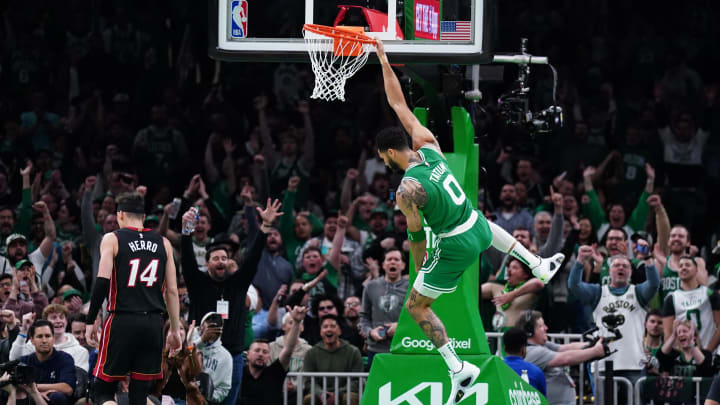 Apr 24, 2024; Boston, Massachusetts, USA; Boston Celtics forward Jayson Tatum (0) makes the basket against the Miami Heat in the first quarter during game two of the first round for the 2024 NBA playoffs at TD Garden. Mandatory Credit: David Butler II-USA TODAY Sports