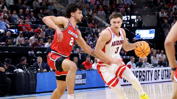 Mar 23, 2024; Salt Lake City, UT, USA; Arizona Wildcats guard Pelle Larsson (3) drives against Dayton Flyers forward Nate Santos (2) during the first half in the second round of the 2024 NCAA Tournament at Vivint Smart Home Arena-Delta Center. Mandatory Credit: Rob Gray-USA TODAY Sports