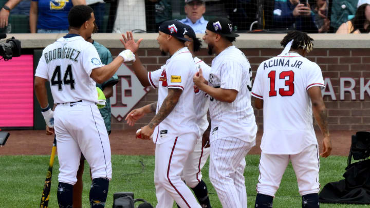 Jul 10, 2023; Seattle, Washington, USA; Seattle Mariners center fielder Julio Rodriguez (44) is congratulated after round 1 of the All-Star Home Run Derby at T-Mobile Park. Mandatory Credit: Steven Bisig-USA TODAY Sports
