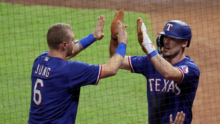 Oct 23, 2023; Houston, Texas, USA; Texas Rangers center fielder Evan Carter (32) celebrates with third baseman Josh Jung (6) after scoring during the first inning of game seven in the ALCS against the Houston Astros for the 2023 MLB playoffs at Minute Maid Park.  Mandatory Credit: Troy Taormina-USA TODAY Sports