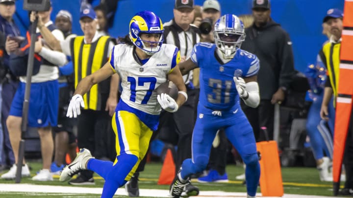 Jan 14, 2024; Detroit, Michigan, USA; Los Angeles Rams wide receiver Puka Nacua (17) runs from Detroit Lions safety Kerby Joseph (31) during the second half of a 2024 NFC wild card game at Ford Field. Mandatory Credit: David Reginek-USA TODAY Sports