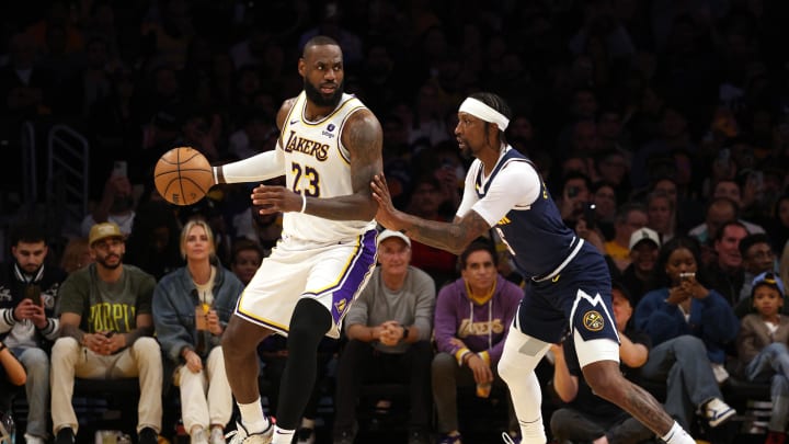 Apr 27, 2024; Los Angeles, California, USA; Los Angeles Lakers forward LeBron James (23) dribbles against Denver Nuggets guard Kentavious Caldwell-Pope (5) during the third quarter in game four of the first round for the 2024 NBA playoffs at Crypto.com Arena. Mandatory Credit: Jason Parkhurst-USA TODAY Sports