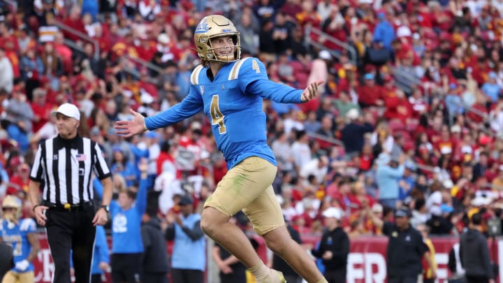 Nov 18, 2023; Los Angeles, California, USA; UCLA Bruins quarterback Ethan Garbers (4) celebrates after a touchdown during the first quarter against the USC Trojans at United Airlines Field at Los Angeles Memorial Coliseum. Mandatory Credit: Jason Parkhurst-USA TODAY Sports