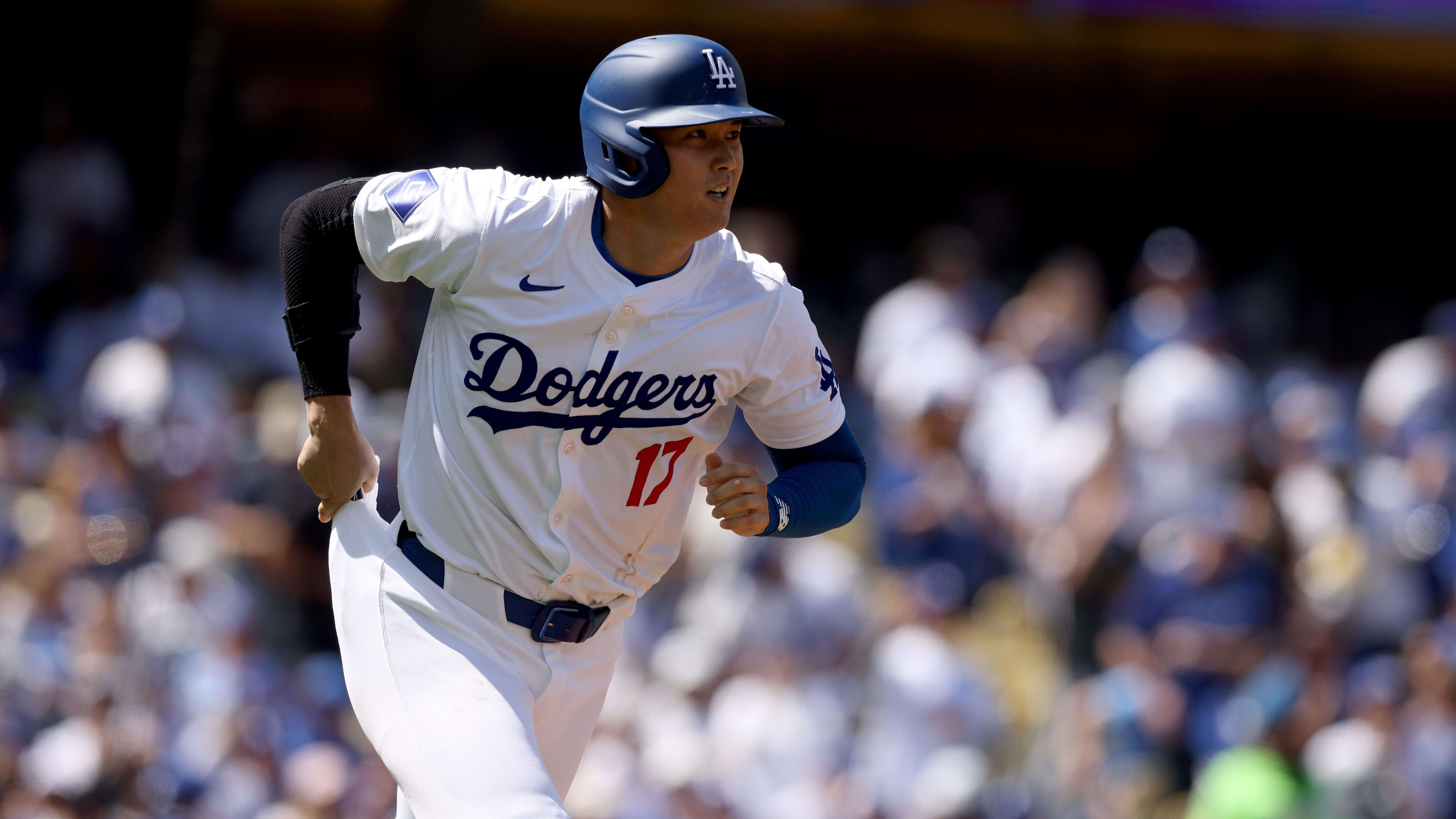 Los Angeles Dodgers designated hitter Shohei Ohtani runs to first base.