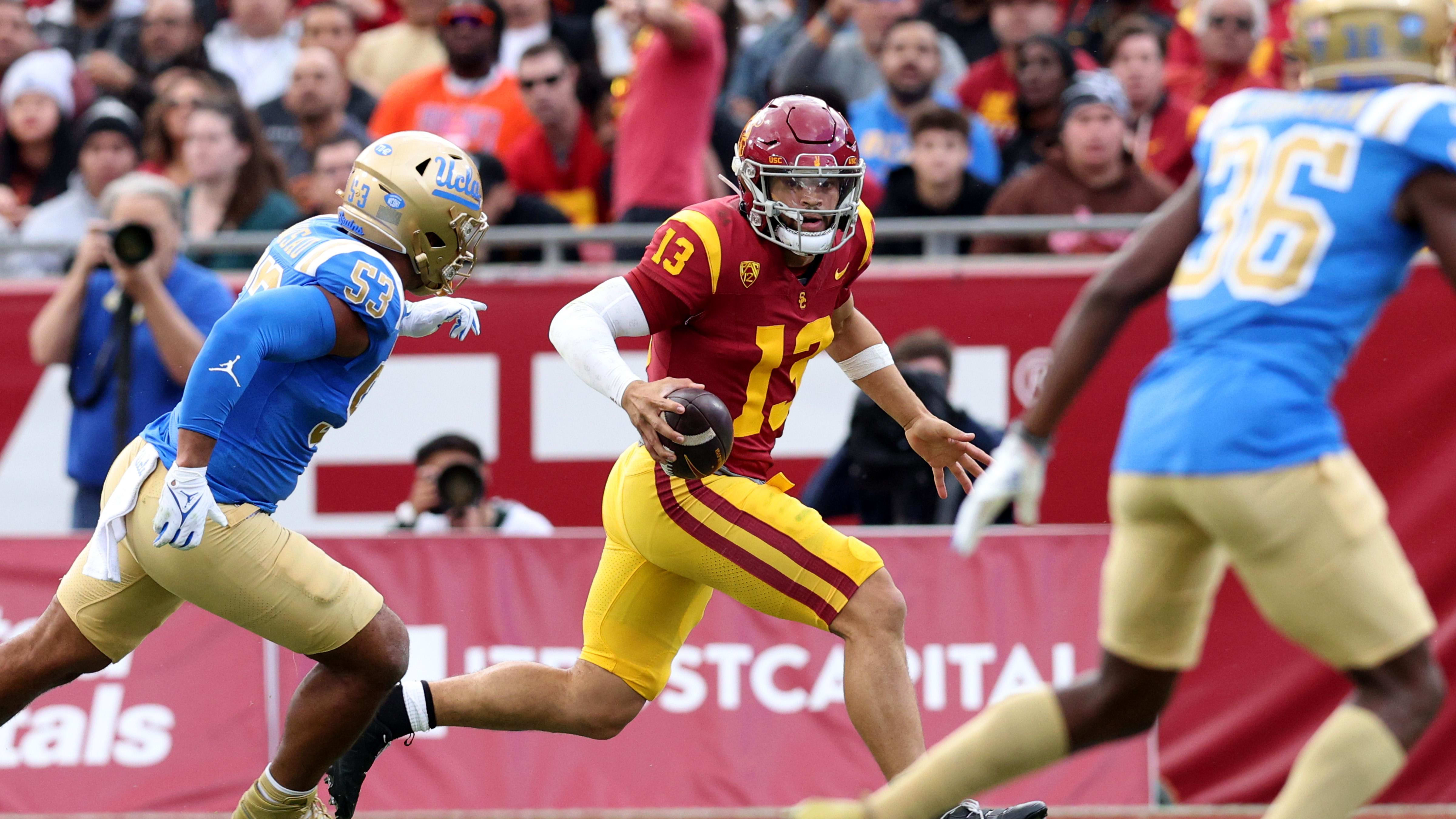 USC Trojans quarterback Caleb Williams (13) scrambles against UCLA.