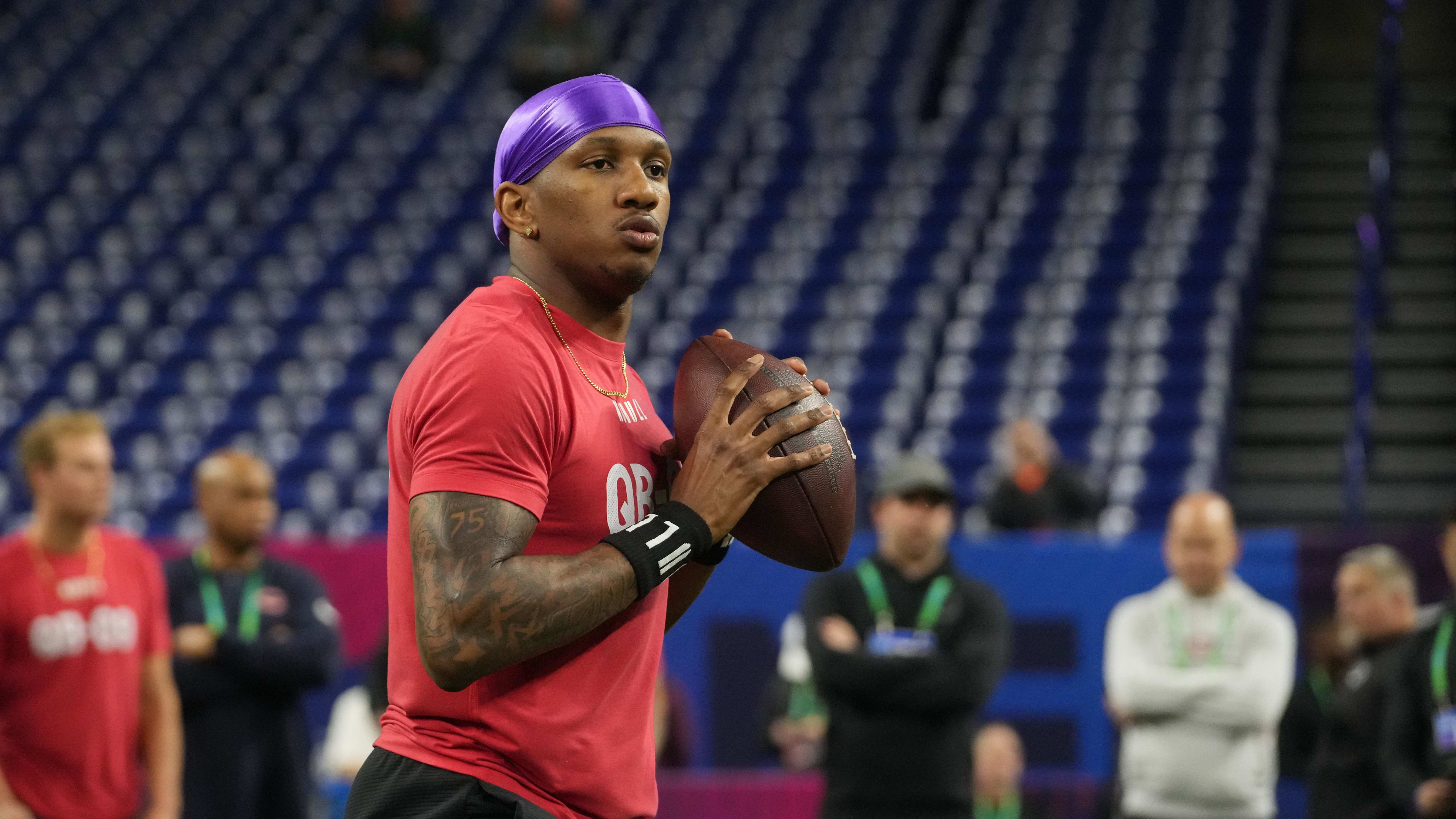 A Dallas Cowboys player wearing a guardian cap in practice