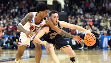 Mar 22, 2024; Spokane, WA, USA; Charleston Cougars guard CJ Fulton (12) dribbles against Alabama Crimson Tide guard Aaron Estrada (55) during the first half in the first round of the 2024 NCAA Tournament at Spokane Veterans Memorial Arena. Mandatory Credit: James Snook-Imagn Images 